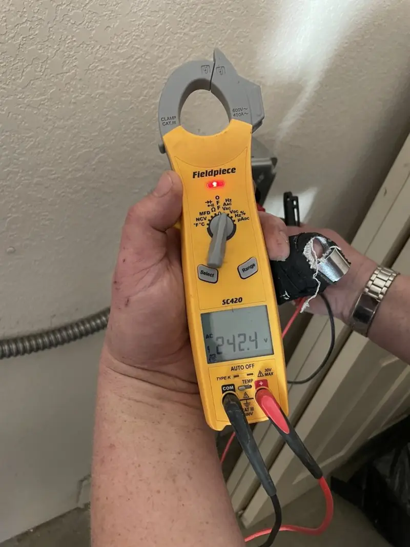Voltage testing with clamp meter during Ceiling Fan Installation in Southside